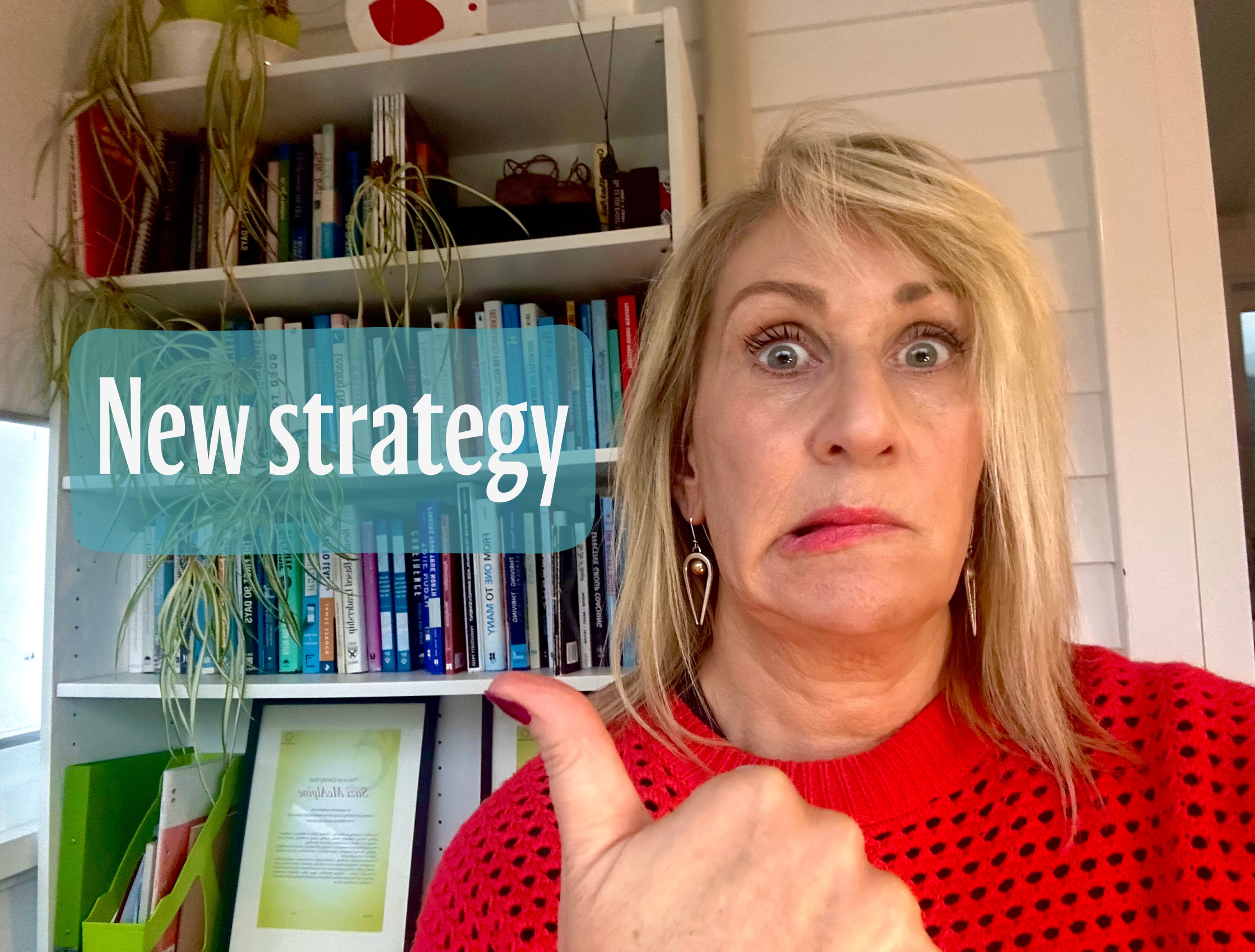 A woman looking very concerned, using her thumb to point to text that reads 'New strategy'